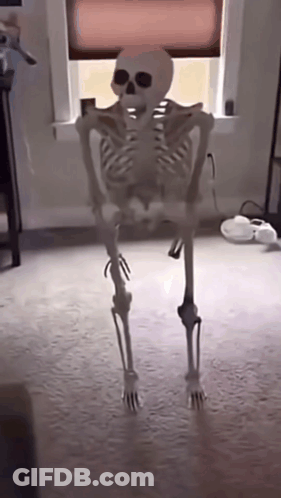 Skeleton Standing In Front Of Window GIF
