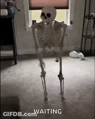 Skeleton Standing In Room Waiting GIF