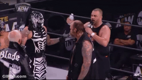 Skeleton Wrestler Talking To Another Wrestler GIF
