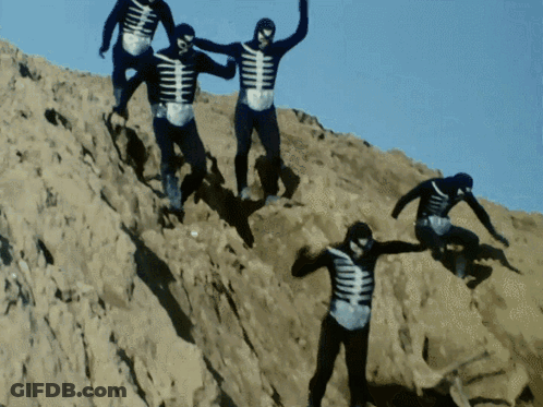 Skeletons Climbing Sandy Hill GIF