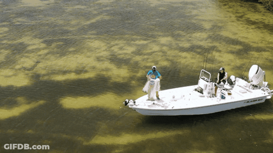 Skiff Guy Throws Fishing Net GIF