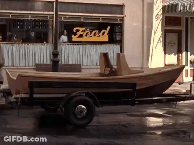 Skiff Parked On Street People Passes By GIF