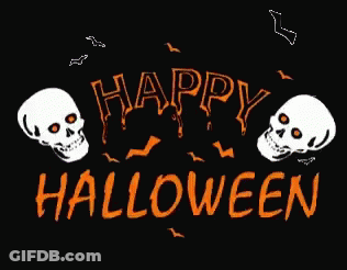 Skull Shaped Pumpkin In Grass GIF