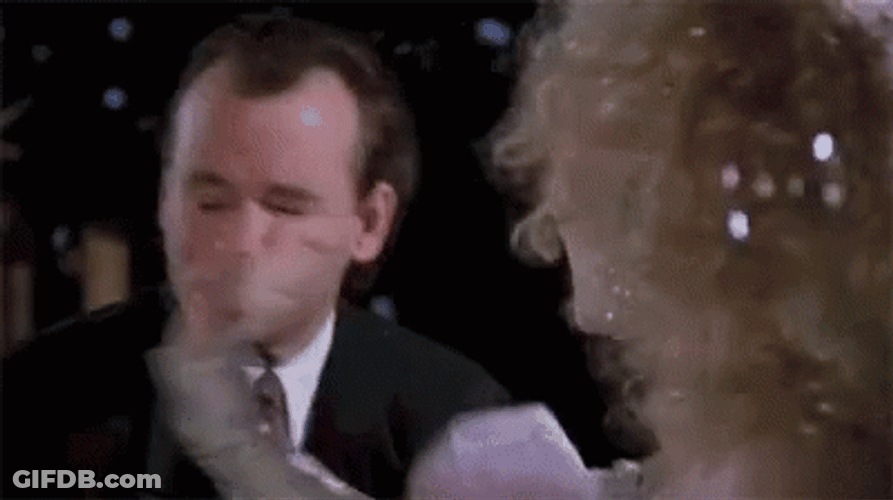 Slapping Scrooge GIF