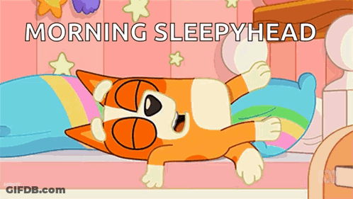 Sleepy Cat Lying On Bed GIF