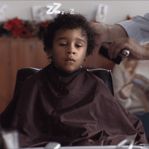 Sleepy Kid Having A Haircut GIF