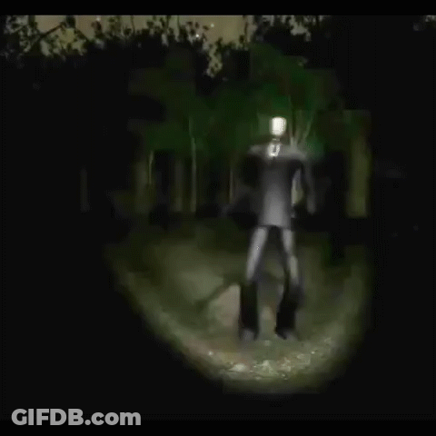 Slender Man Standing In Woods At Night GIF