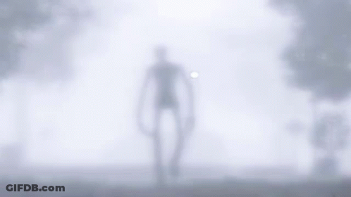Slender Man Walking Through Fog In Field GIF