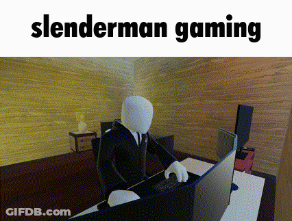 Slenderman Sitting At Desk In Front Of Computer GIF