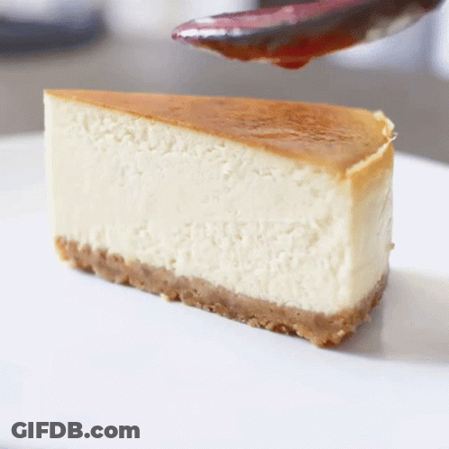 Slice Of Cheesecake With Cherry Sauce GIF