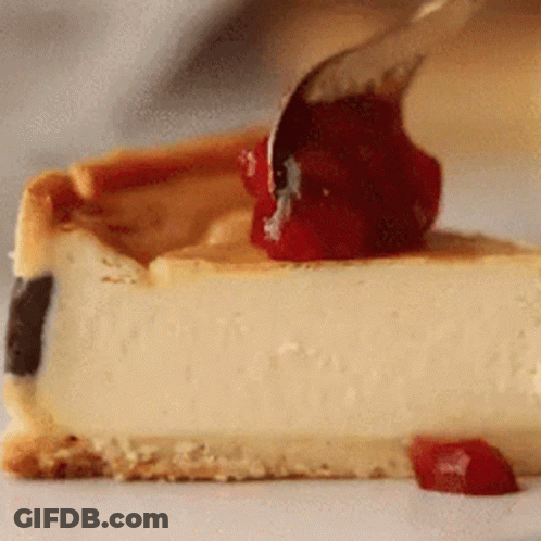 Slice Of Cheesecake With Cherry Sauce GIF
