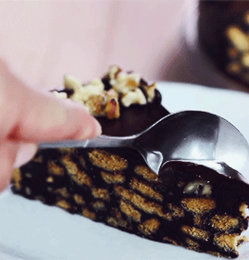Slicing Chocolate Cake With Cashew Nuts GIF