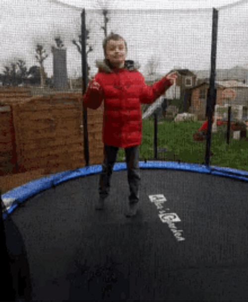 Small Boy Jumping On Trampoline GIF