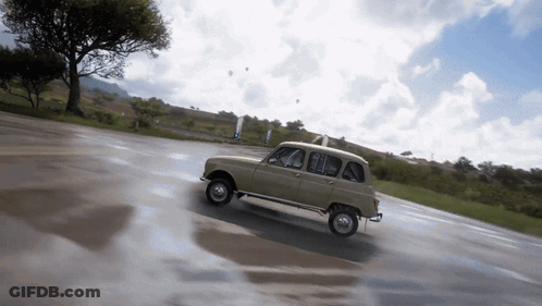 Small Car Driving Down Wet Road GIF