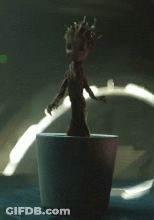 Small Groot Figurine In White Pot GIF