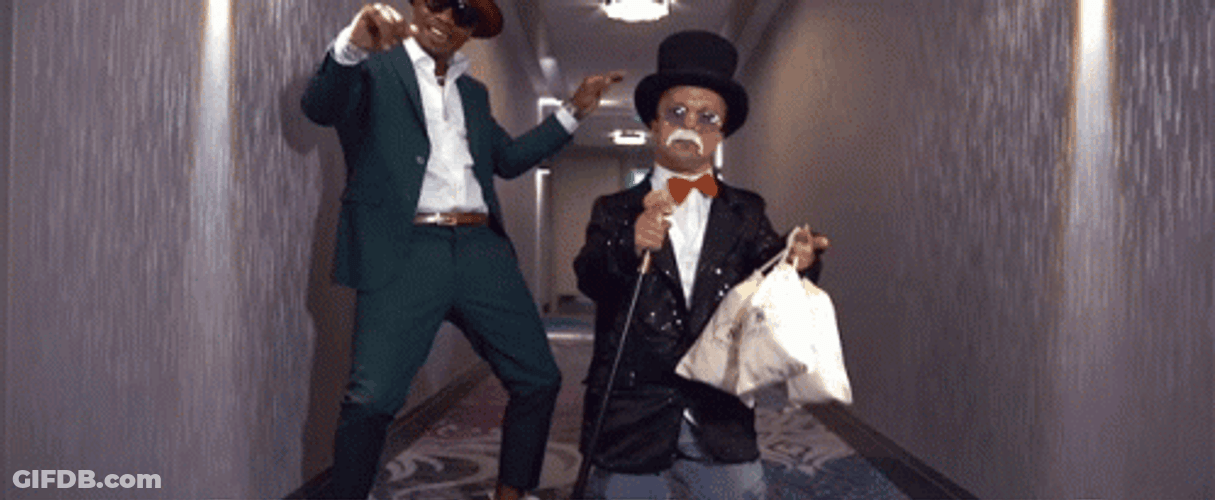 Small Mr Monopoly Holding Bags Of Money GIF