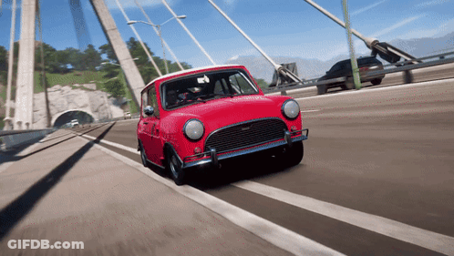 Small Red Car Driving On Bridge GIF