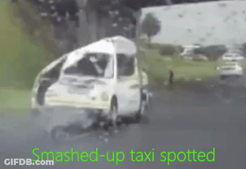 Smashed Up Taxi Driving Down Road GIF