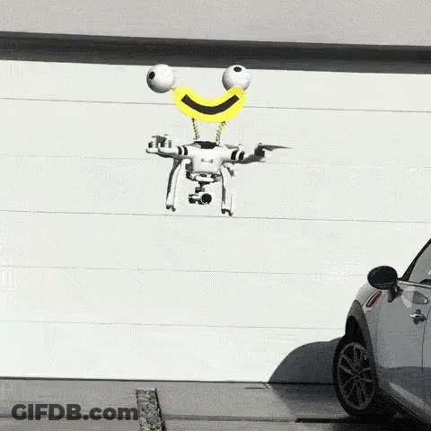 Smiley Drone Flying Over Parked Car GIF