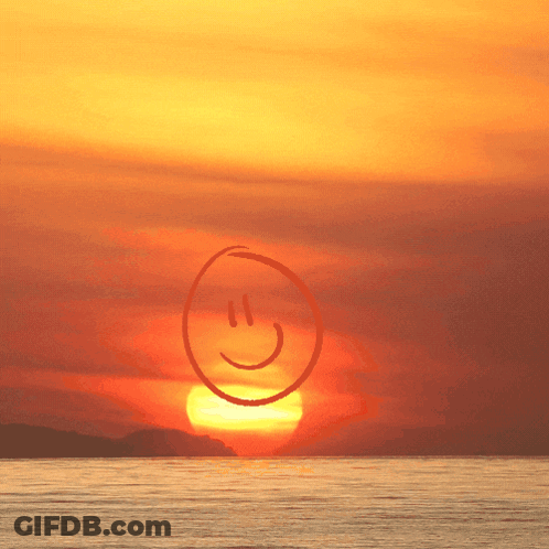 Smiley Face In Front Of Sunset GIF