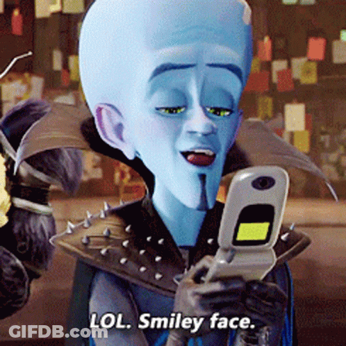 Smiley Face Saying Lol On Cellphone GIF