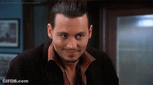 Smiling Bearded Man In Black Jacket And Red Striped Shirt GIF