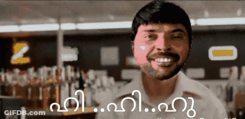 Smiling Bearded Man In Front Of Sign GIF
