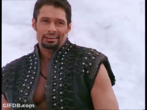 Smiling Bearded Man In Studded Black Vest GIF