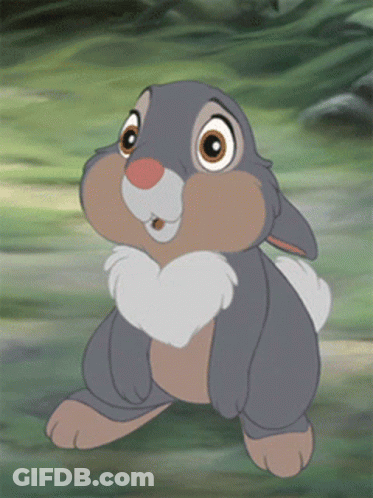 Smiling Cartoon Rabbit In Grass GIF