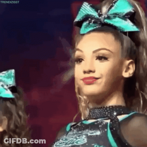 Smiling Cheerleader With Blue Bow GIF