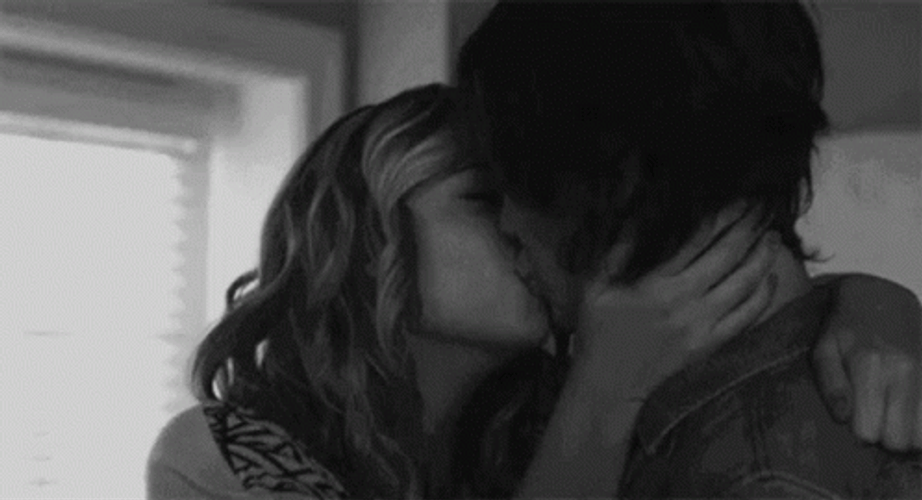 Smiling Couple Hugs And Kisses GIF