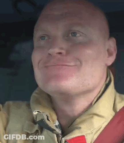 Smiling Fireman Looking Up GIF