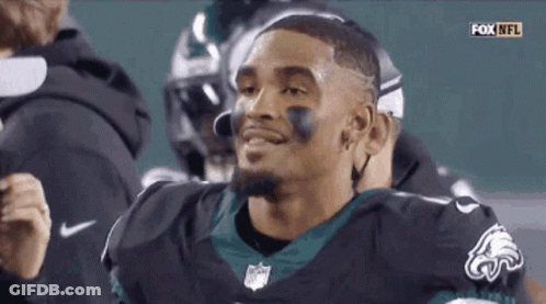 Smiling Football Player In Black Eagles Jersey GIF