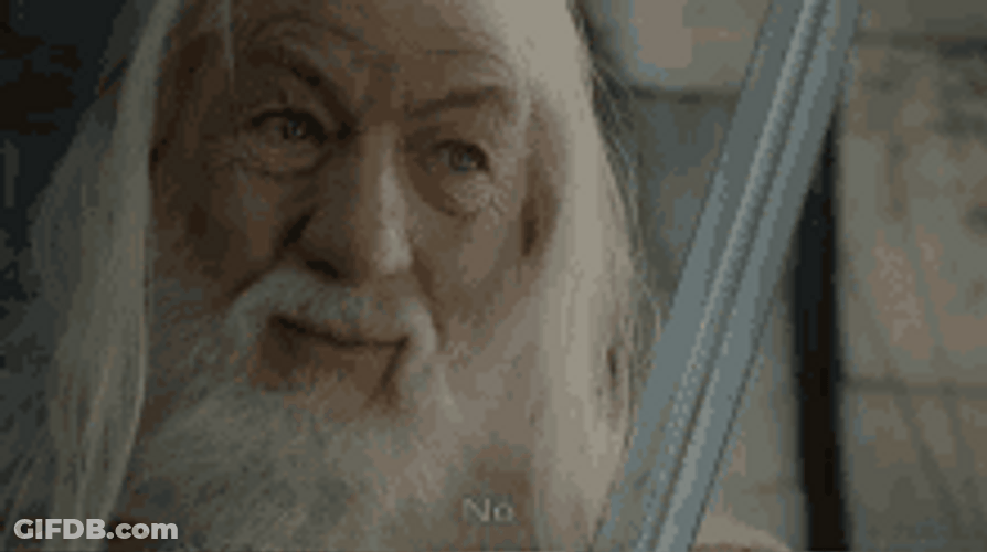 Smiling Gandalf Saying No GIF