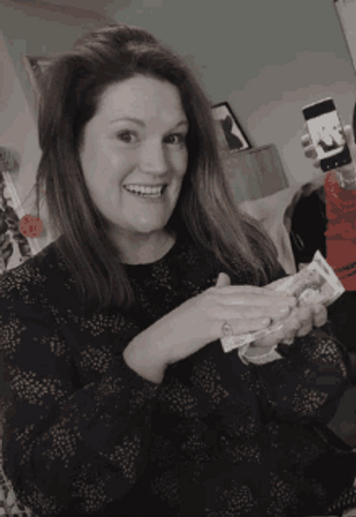 Smiling Girl Throwing Money GIF