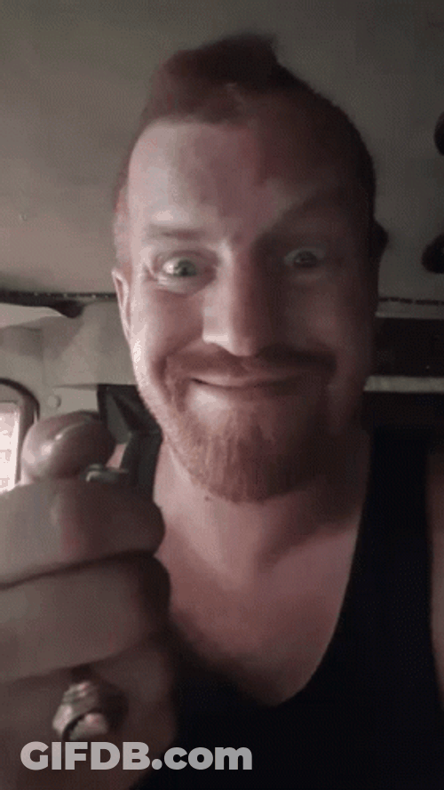 Smiling Guy Lighting Lighter GIF
