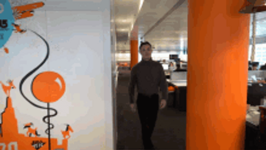 Smiling Guy Walking Turn Around Flipping Off GIF