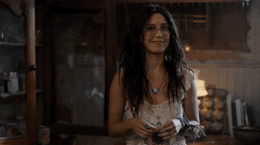 Smiling Happy Woman Shrugs GIF