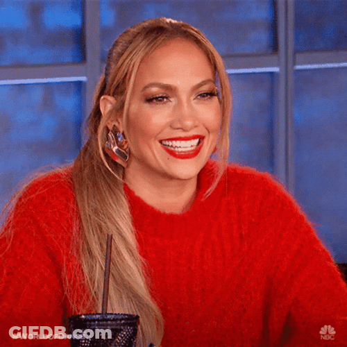 Smiling Jlo In Red Sweater GIF