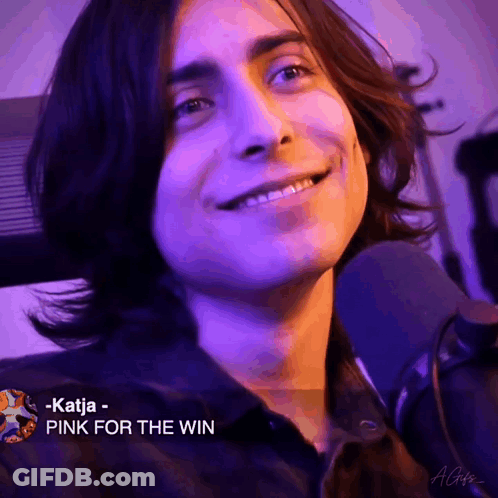 Smiling Long-Haired Man Mic Katja - Pink For The Win GIF