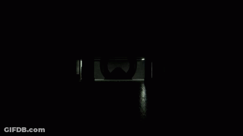 Smiling Man Adjusting Glasses In Black Shirt GIF