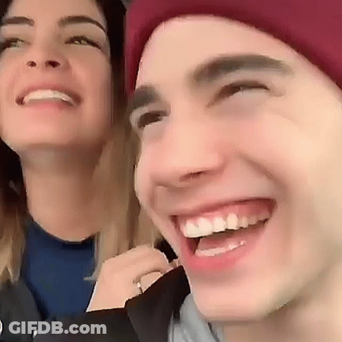 Smiling Man And Woman With Red Hat GIF