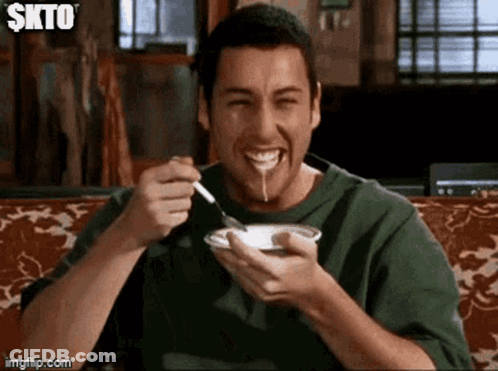Smiling Man Eating With Spoon GIF