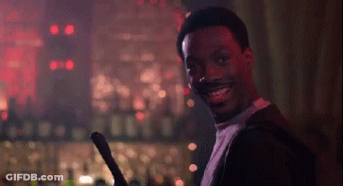 Smiling Man Holding Sword In Bar GIF