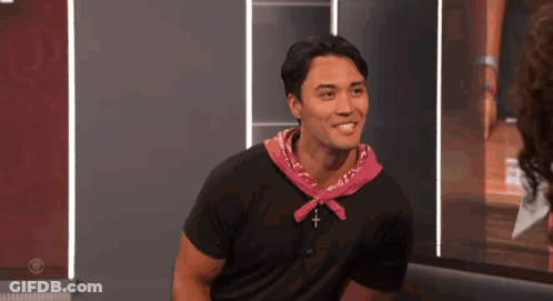 Smiling Man In Black Shirt And Pink Bandana GIF