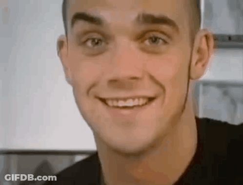 Smiling Man In Black Shirt GIF