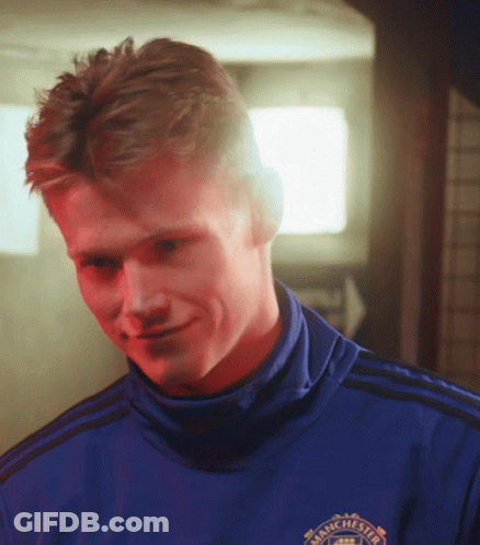 Smiling Man In Blue Shirt Saying Manchester GIF