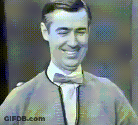 Smiling Man In Bow Tie And Sweater GIF