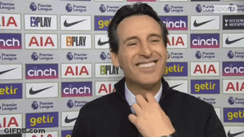 Smiling Man In Front Of AIA Cinch Ads GIF