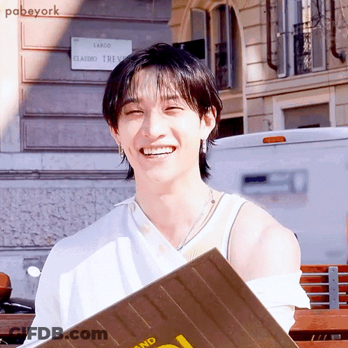 Smiling Man In Front Of Largo Claudio Trevi Sign GIF